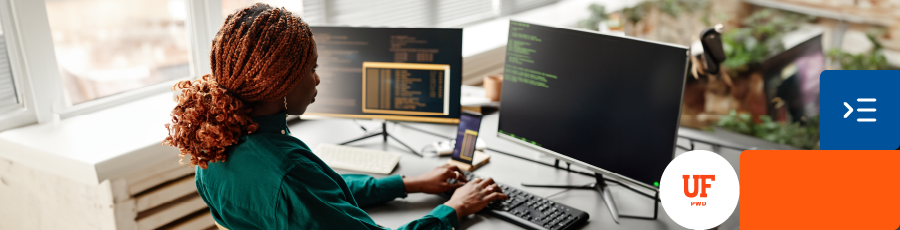 working on a code  in her computer and reading learning about the benefits of ISC2 certification in Florida